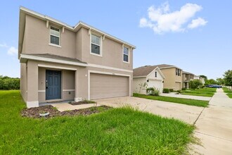 Building Photo - "Spacious 5-Bedroom Haven with Stunning Lake Views & Granite Elegance in Riverview!"