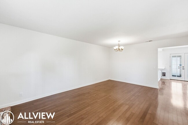 Building Photo - Fully Renovated 2 Bed Townhome with Private Patio, 2-Car Garage & Community Pool