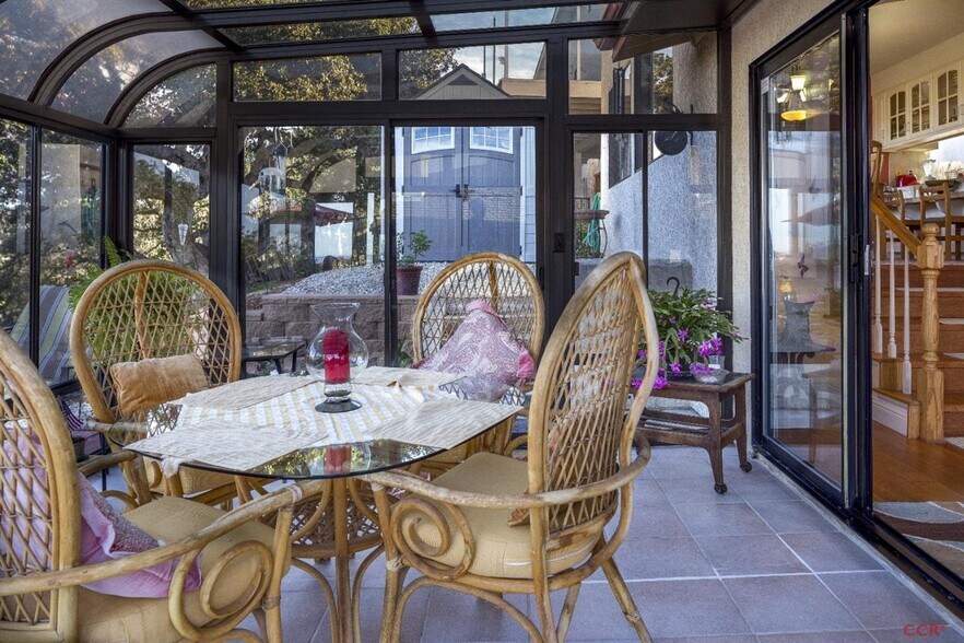 Glassed in Sunroom attached to house, opens to brick patio - 684 Shamrock Ln