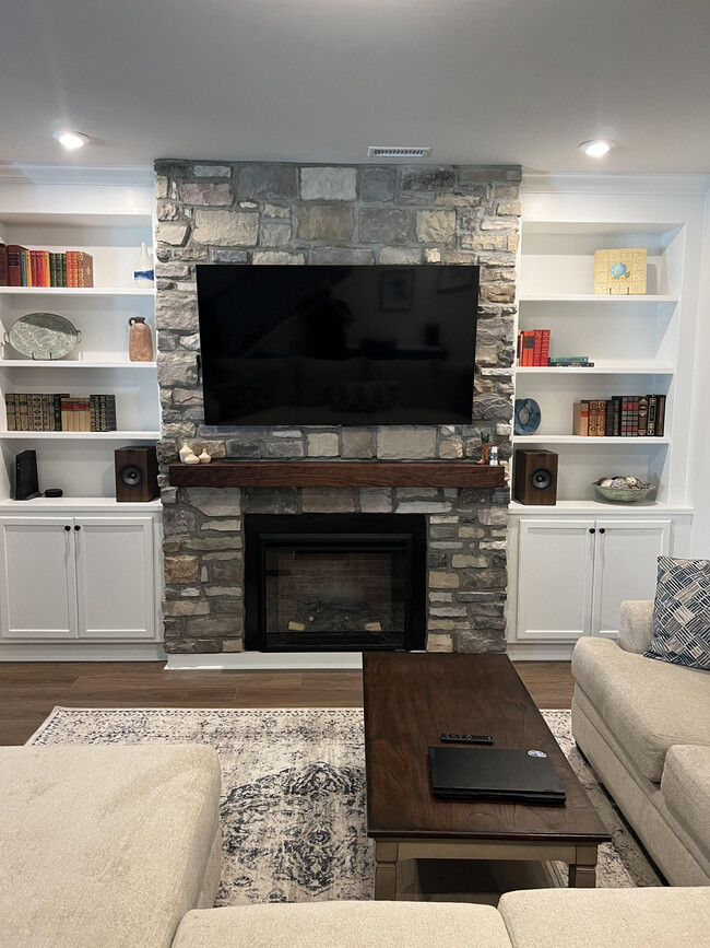 Main living room with upgraded built ins. Shown furnished for display purposes. - 184 Norwell Ln