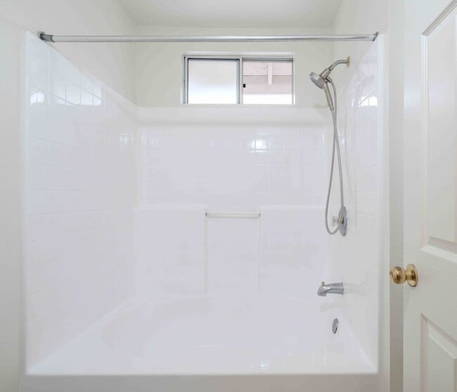 Building Photo - Gated Townhome with Updated Kitchen and Private Backyard