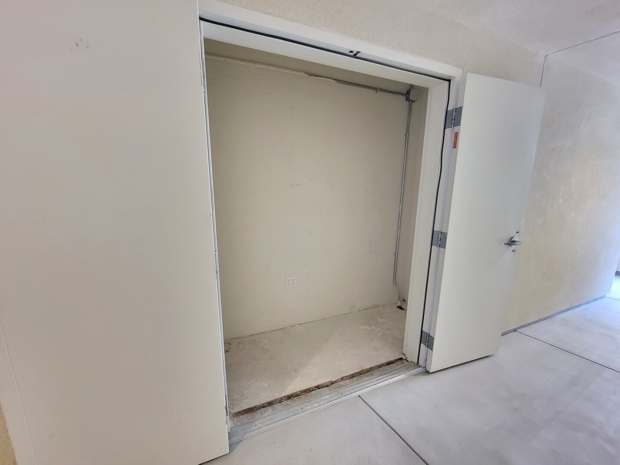 External storage attached to the condo located just outside the front door - 12655 Bluff Creek Dr