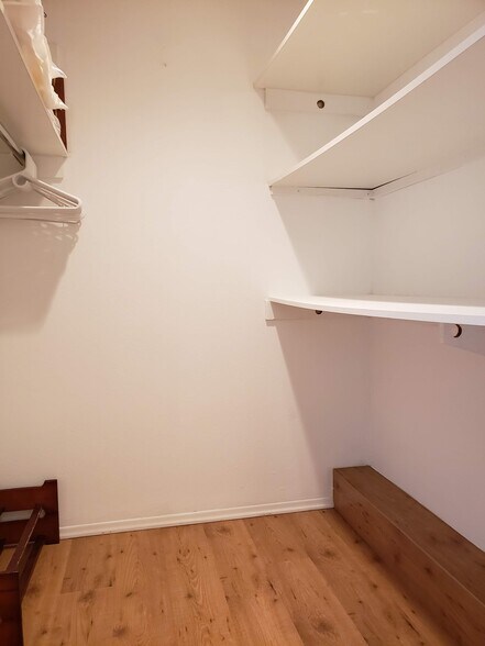 Walk in closet with built in shelving - 665 The Village