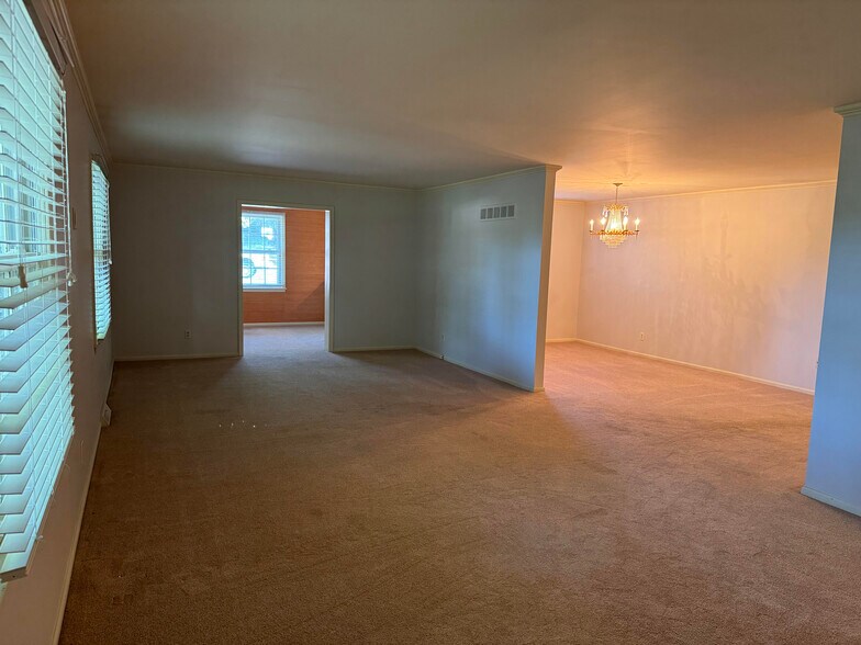 Living room and dining room with Den - 104 Winston Pl