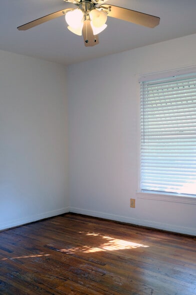 Front bedroom with pine floor - 718 Cordell St