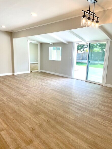 Living room with sliding door to backyard - 10134 Memory Park Ave