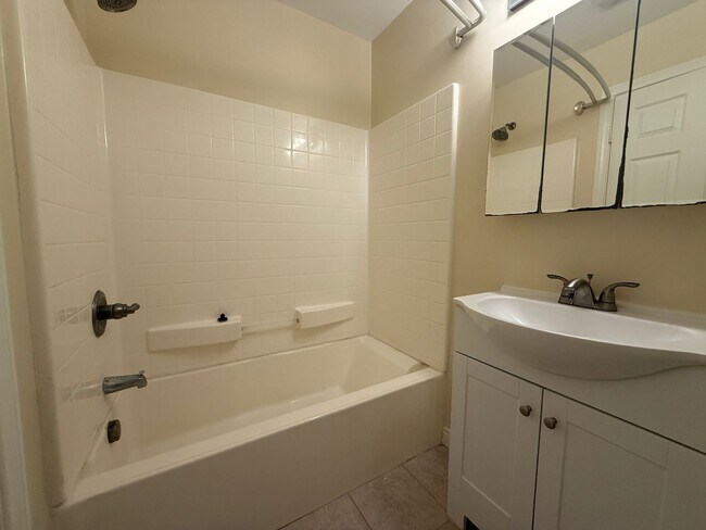 Building Photo - Upgraded Condo with Private Patio, AC, Pool, Gym, and Covered Parking in Gated Community