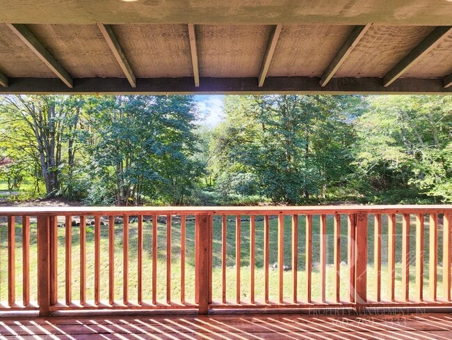 Building Photo - Vaulted Ceilings, Unique Designer Kitchen & Expansive Half-Acre Setting with Flexible Living Spaces