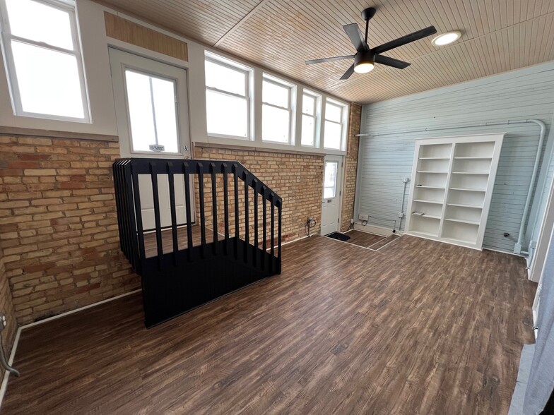 Living Room with with View of Patio Stairs and Front Door - 1216 Turner St