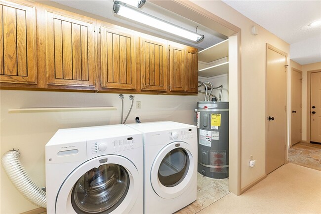 Laundry with washer and dryer - 7400 Stinson Ave