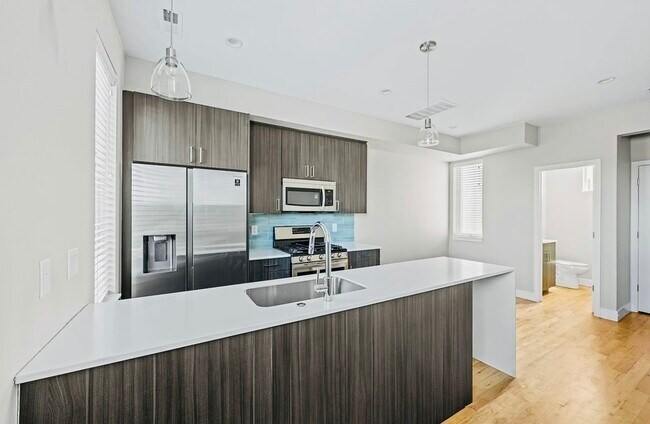 Experience the elegance of a modern kitchen, where style meets functionality. - Harley House