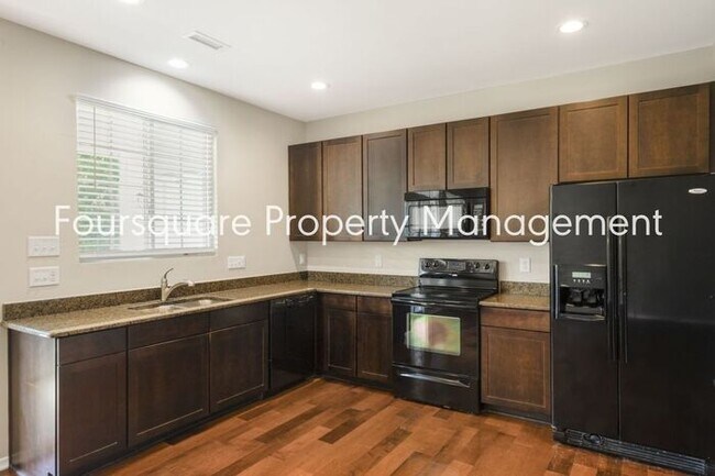 Building Photo - Charming Townhome with Open Layout, Back Patio & One-Car Garage – Near RTP, RDU & Everyday Conven...