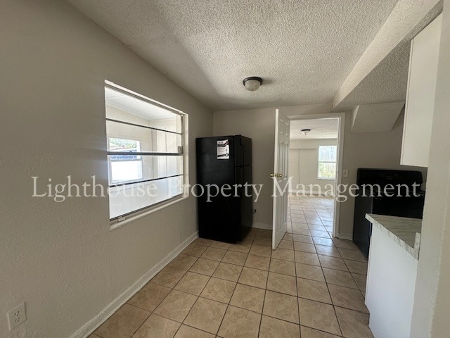 Building Photo - Bright 4 Bedroom Home With Tile Flooring Throughout