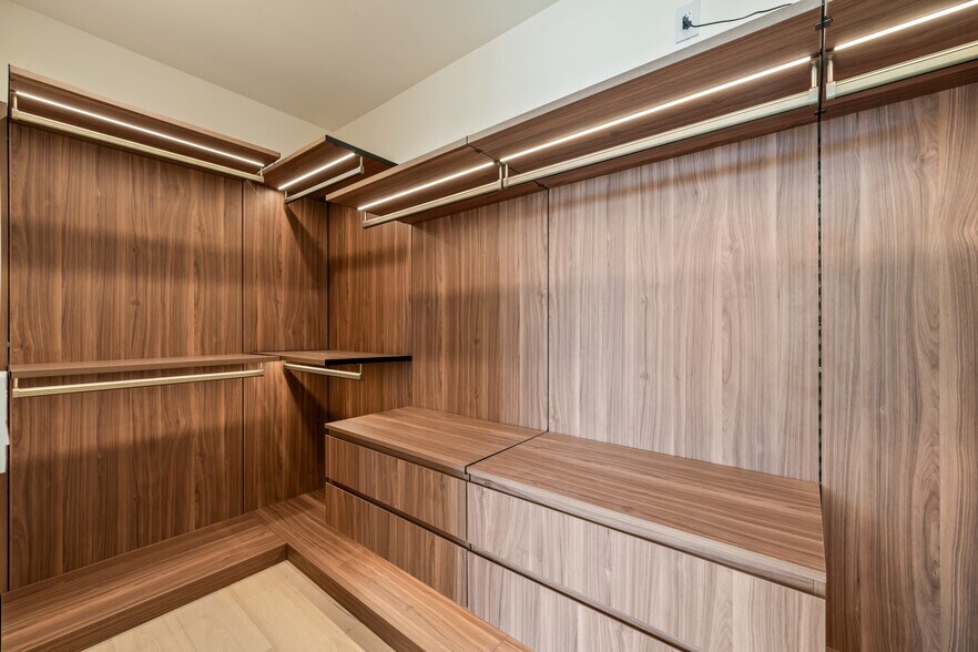 Master closet with built-in shelves, drawers, and LED lighting - 836 Waterloo St
