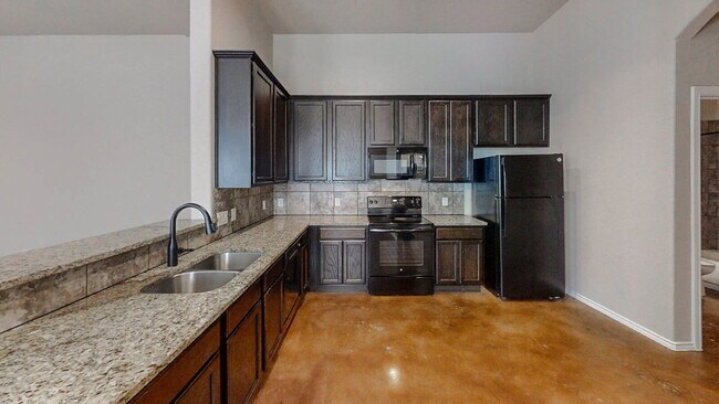 Building Photo - 3 Bedroom Duplex with Stained Concrete Floors and Greenbelt Views!