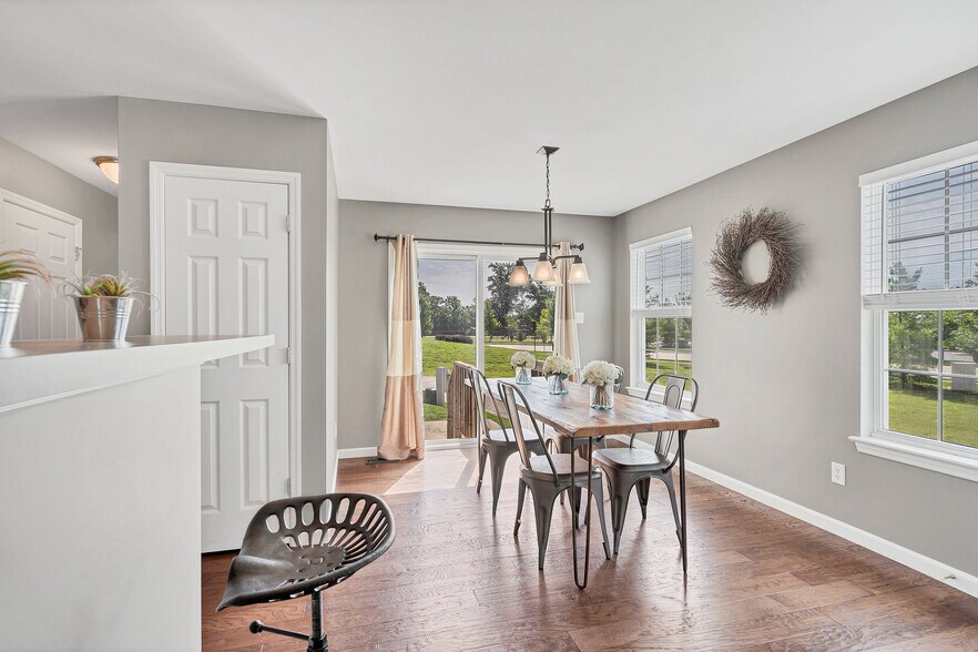 Dining room features 2 windows plus sliding door to patio - 201 Countryshire Dr