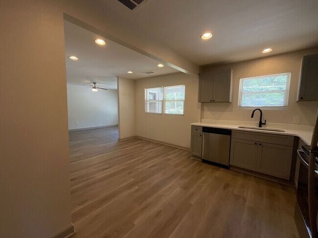 Building Photo - **Spacious 4BR with Modern Upgrades & Cove...