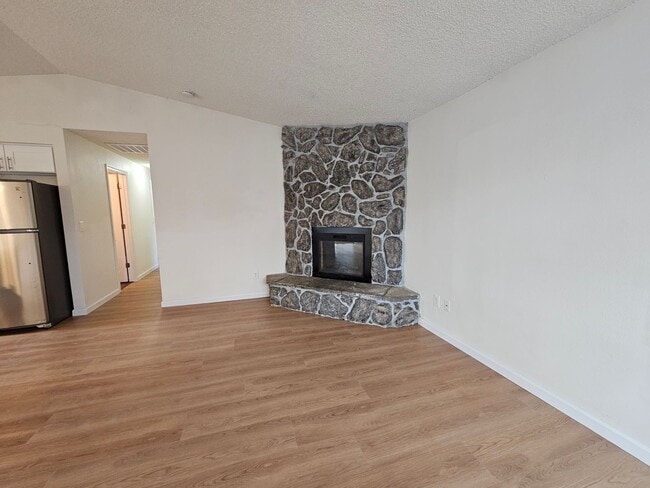 Building Photo - Charming Single-Level Home Featuring New Hardwood Floors, Bright Bedrooms & Open-Concept Living