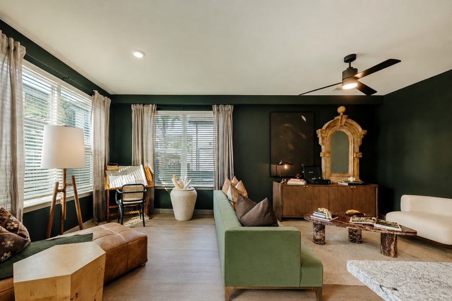 Stylish apartment living and dining area with oversized windows, designer finishes, and open-concept layout. - Asher