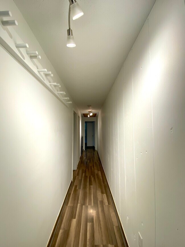 beds, baths, and laundry off hallway - 8 Plaza Village Rd