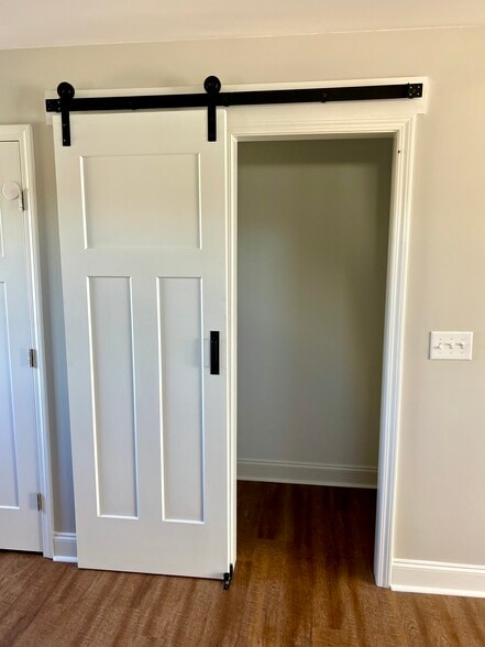 Large pantry with sliding barn door and plenty of shelving - 2312-A Belle Ave NE