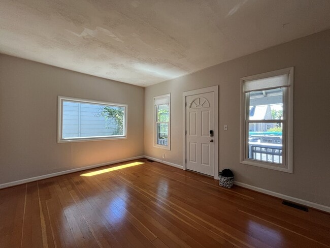 Building Photo - Charming Cottage with Hardwood Flooring, Modern Kitchen & Beautiful Outdoor Living Areas