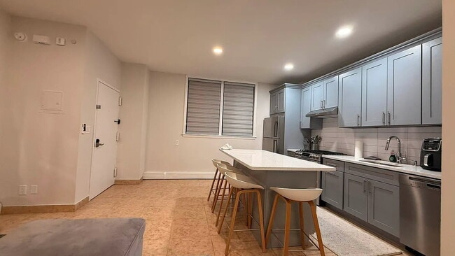 Building Photo - "Charming 1-Bedroom Furnished Apartment with Hardwood Floors in Queens – 750 Sq Ft of Comfort!"