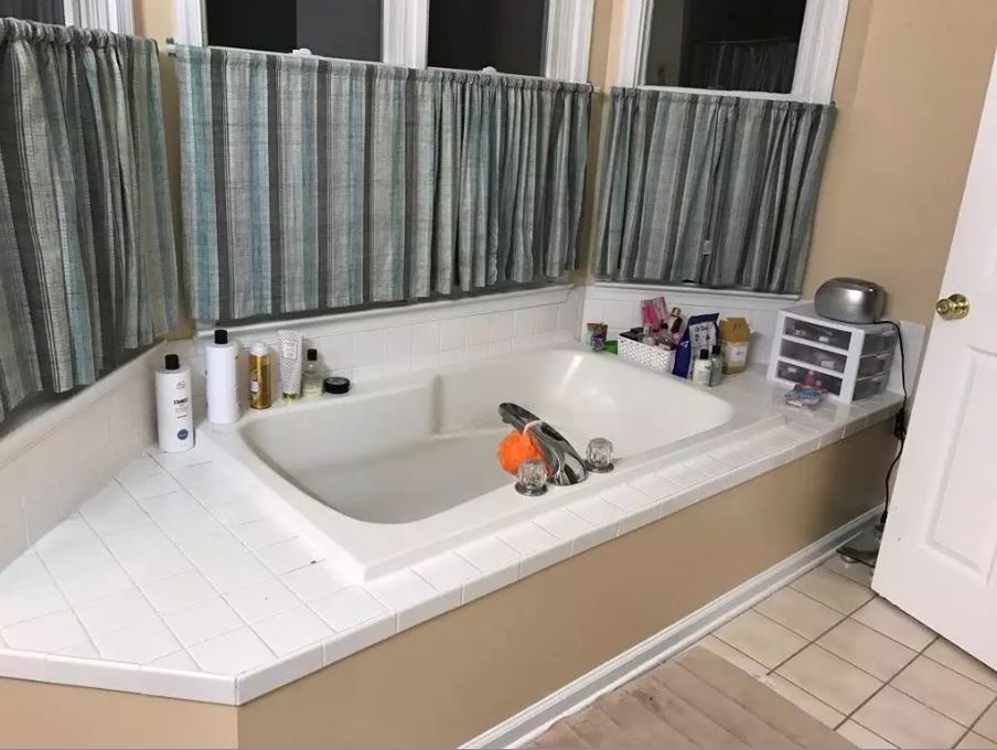 Soaking tub, bay window, shower, and double vanity are highlights of master bath - 1809 Stark Drive