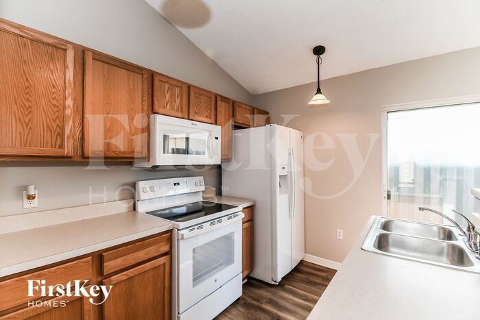 Building Photo - 6565 Gentle Oaks Dr