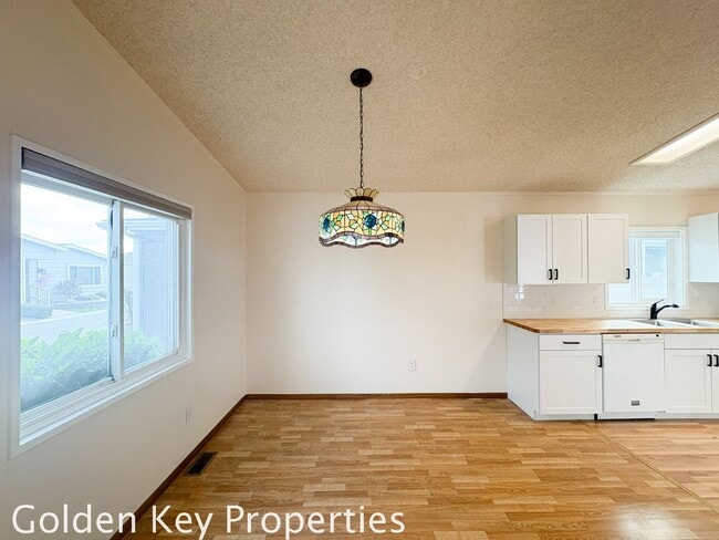 Building Photo - Welcome to the spacious single-level manuf...