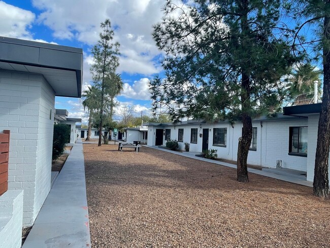 Building Photo - OPEN HOUSE! Remodeled Two Bedroom, End Unit with A/C and Large Fenced Yard