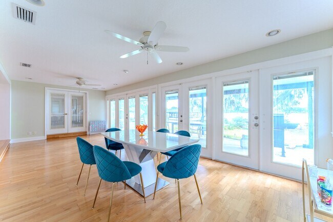 Building Photo - Lake Jessamine Luxury: Solar-Powered Waterfront Retreat on 1.14 Acres with Dock & Boathouse