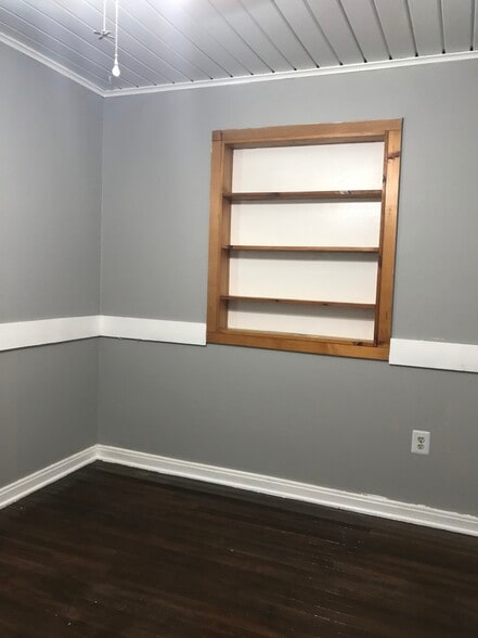 Book shelf over the bed for additional display or storage - 1407 W Church St