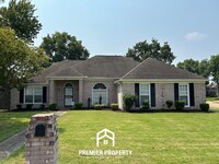 Building Photo - Spacious 3BR/2BA Near Southwind | 1,958 Sq Ft, Brick Fireplace, 2-Car Garage & Quiet Cove