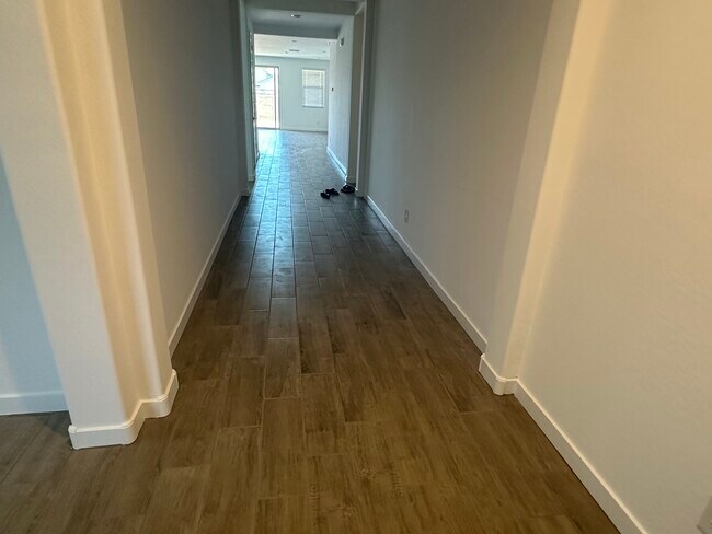 Tiles flooring wide hallway - 3110 N 199th Dr