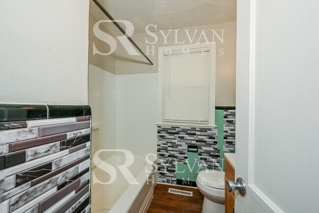 Building Photo - The living is easy in this 4 bedroom, 1.5 bathroom home