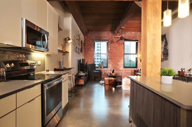 Chef islands and quartz countertops in kitchen - Modera Lofts