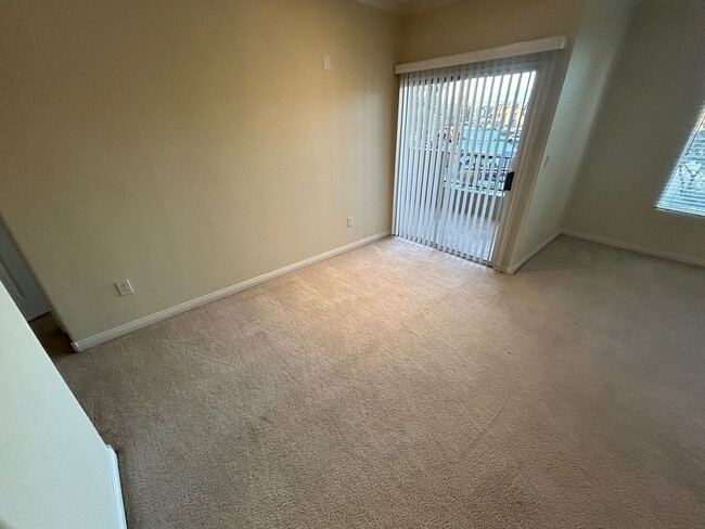 Building Photo - ADORABLE 2 BEDROOM 2 BATHROOM CONDO LOCATED IN A GATED COMMUNITY