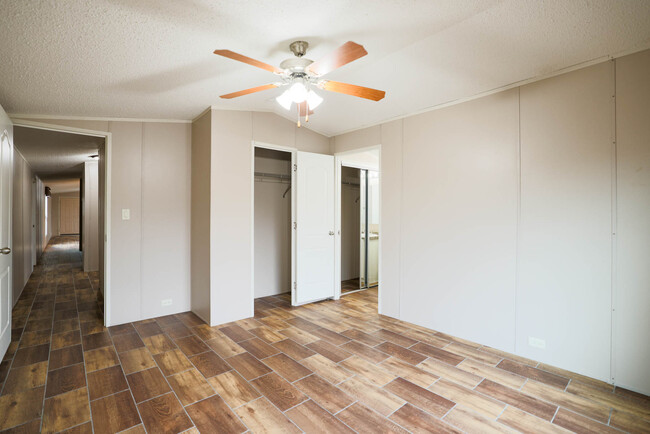 Primary Bedroom w/ closet and Primary Bathroom entrance. - 1225 Orizaba