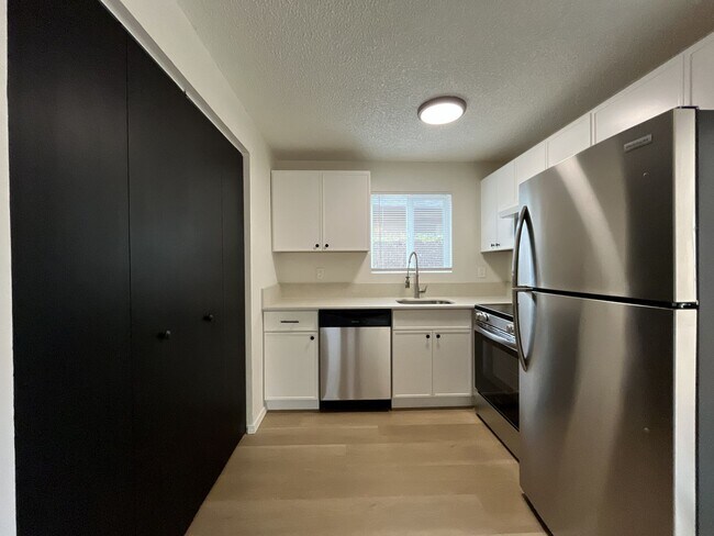 Building Photo - Inviting 2 Bedroom Home with Open Layout, Stainless Steel Appliances & Private Outdoor Retreat
