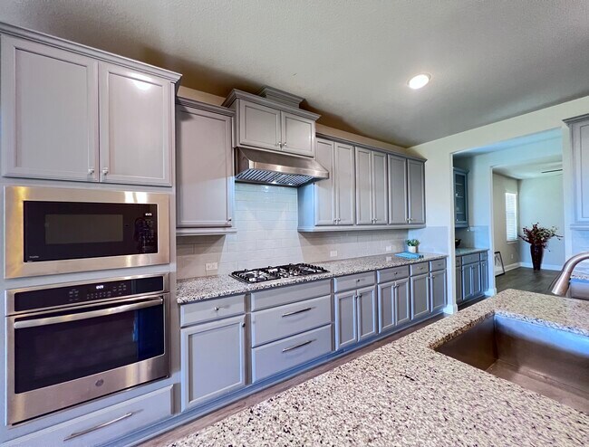 Looking from Kitchen through Butler's Pantry. Flex space in background. - 3241 Aurelia Ln