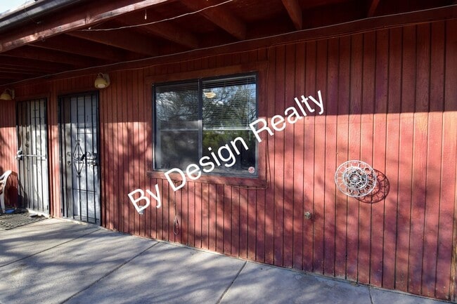Building Photo - Charming Mid-Century Style: Vaulted Beams & Private Oversized Yard