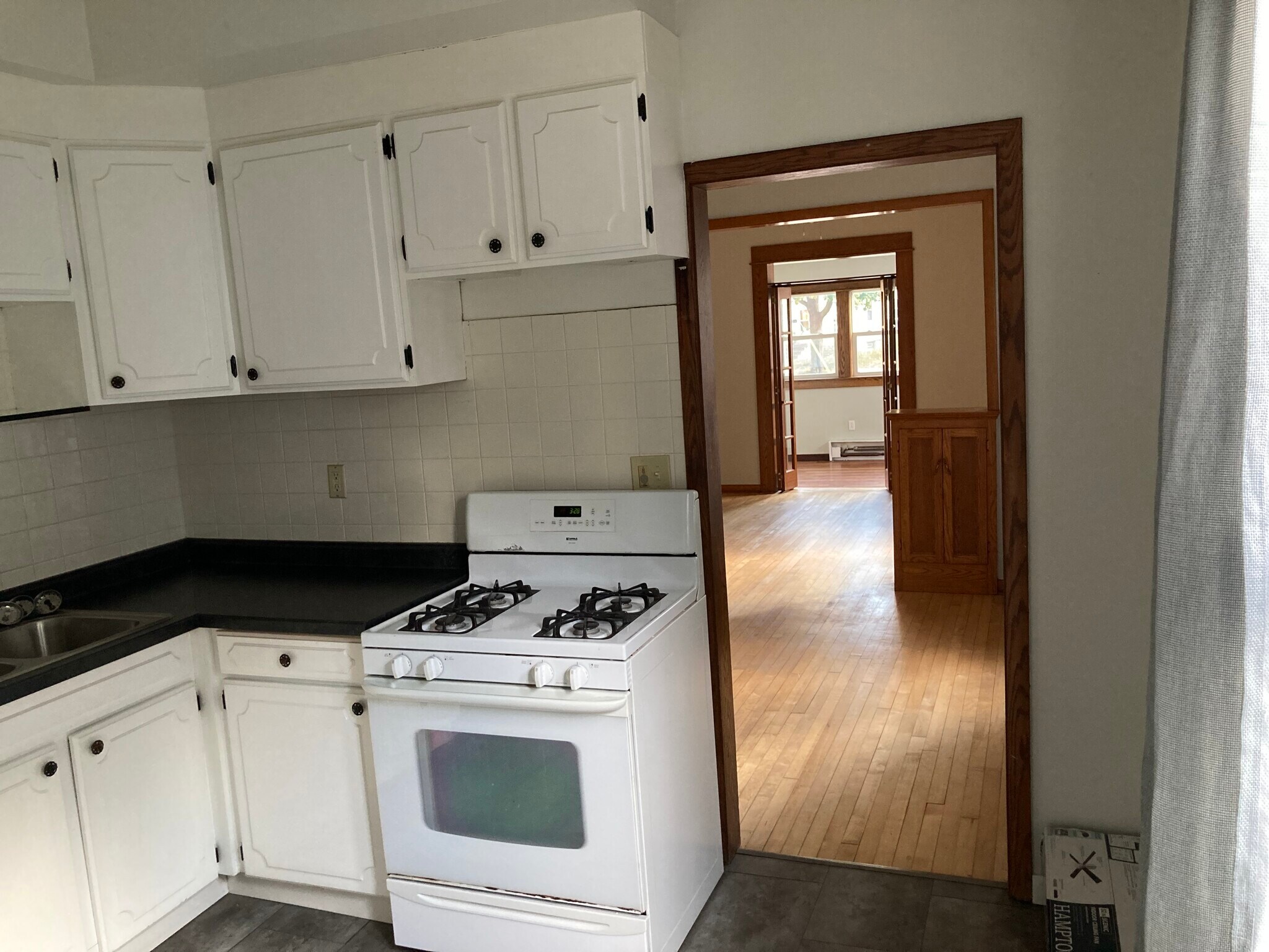 Kitchen into dining and living rooms - 712 6th St NE