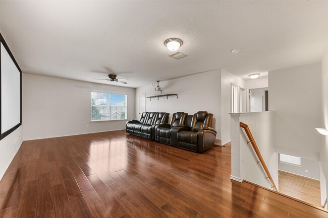 Living Room (Upstairs) *furniture, movie projector, and screen included* - 5709 Valley Stream Way