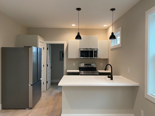 modern kitchen with island seating - 58 Albemarle Rd