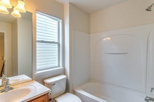 Full Bathrooms: Glass front door, master bath with separate shower and a beautiful tub with jets, Tile in the home, wood blinds throughout, crown molding. - 23609 Youpon Lake Lane