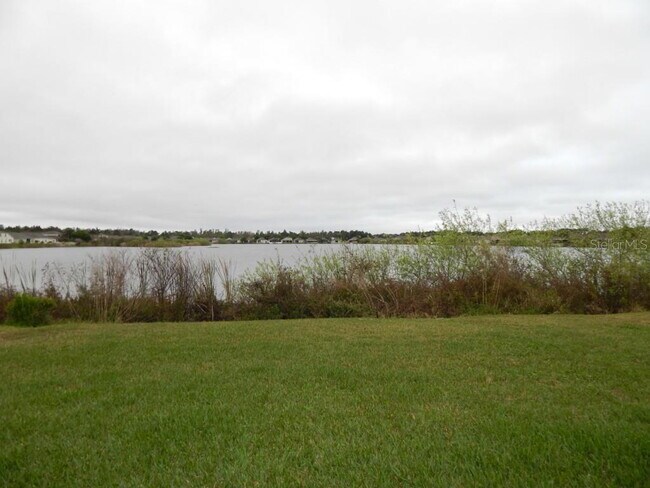 Building Photo - **Charming 4BR/2BA Pond-View Home with Boat Ramp Access – East Orlando **
