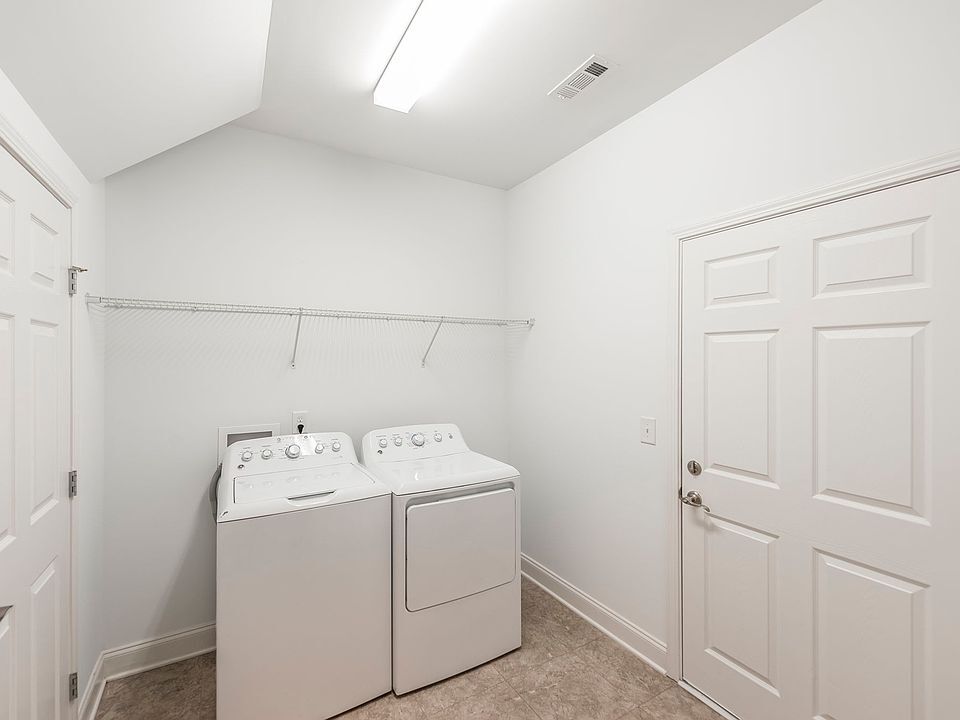 Laundry Room. Storage Door Left and Garage Door Right - 2120 Sullivan St