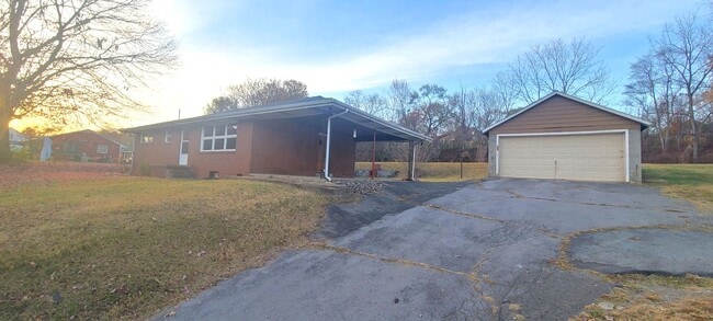 Building Photo - HALF OFF FIRST MONTH RENT! Single family brick home with full unfinished bsmt & detached garage