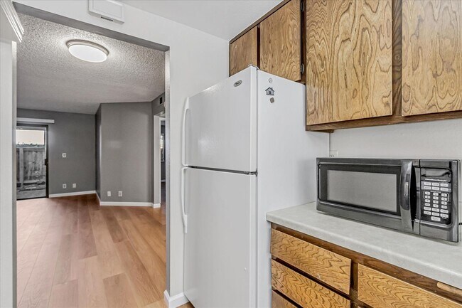 Building Photo - Stylish End-Unit Condo l Private Patio l Community Pool